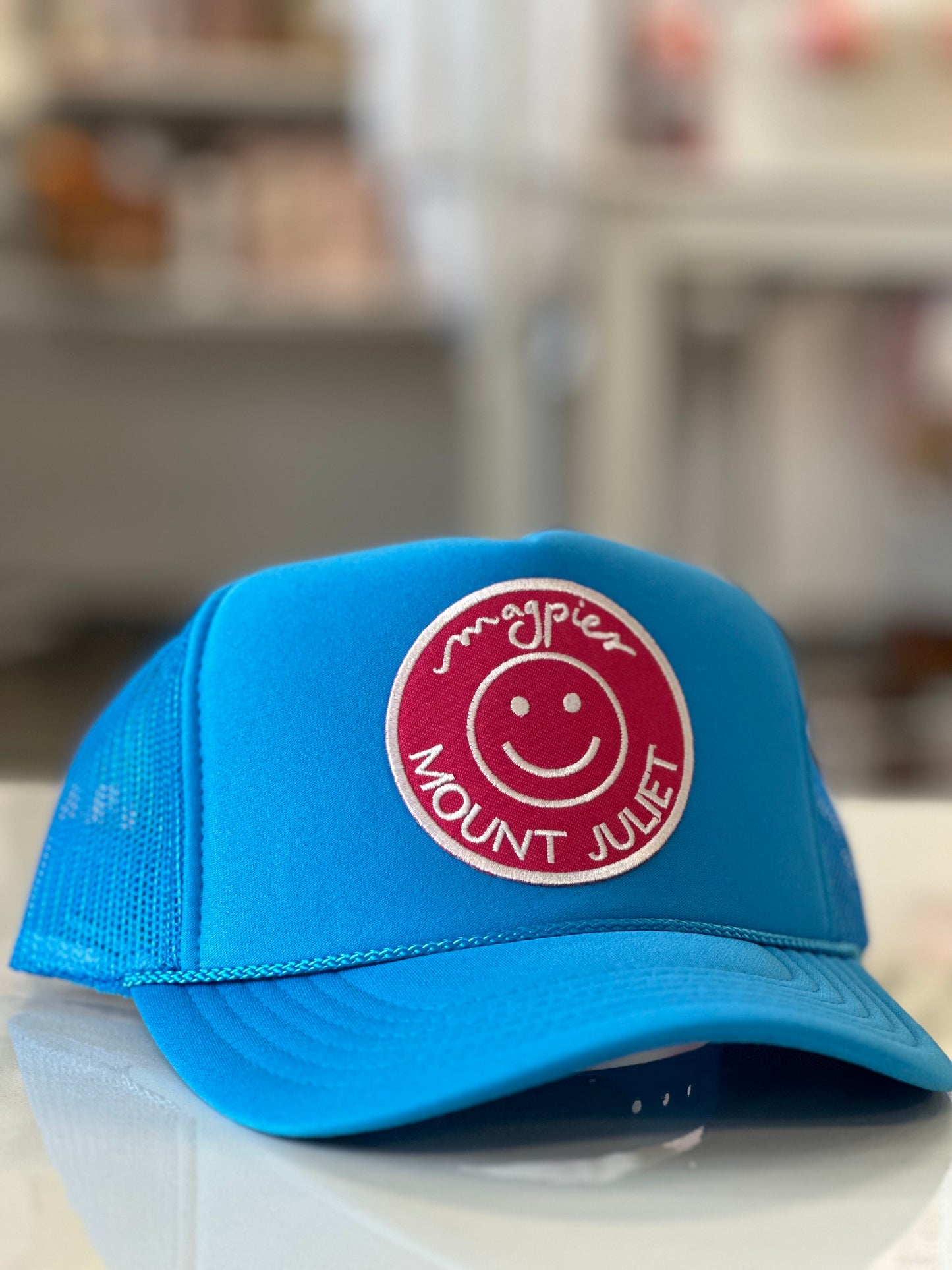 Magpies Mt Juliet Patch Trucker Hat | Neon Blue and Pink