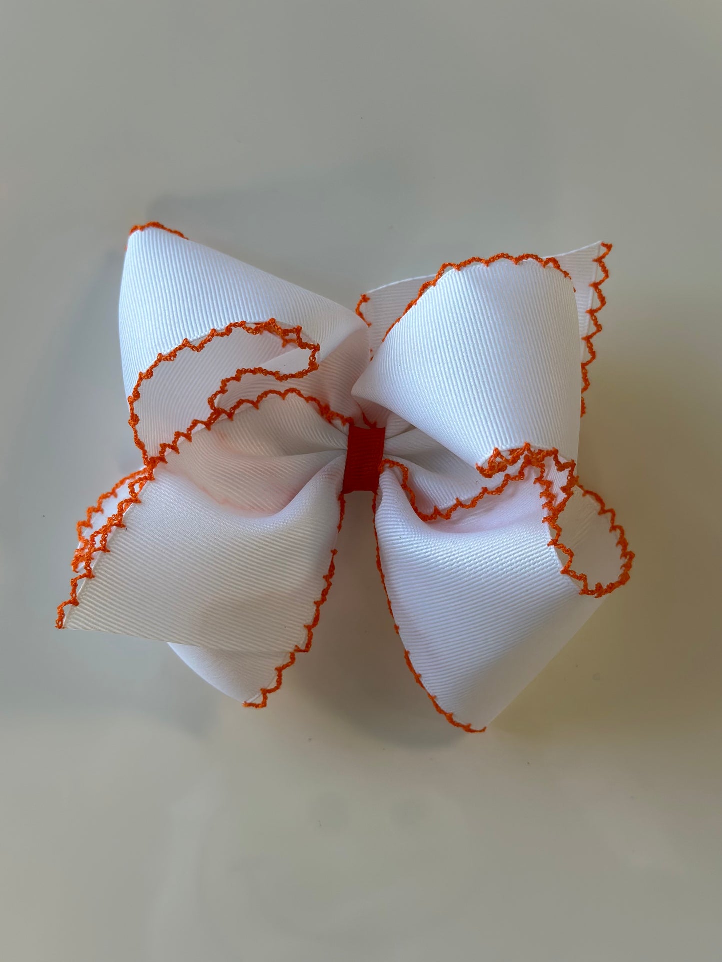 King Grosgrain Hair Bow with Contrasting Moonstitch Edge and Wrap | Orange And White